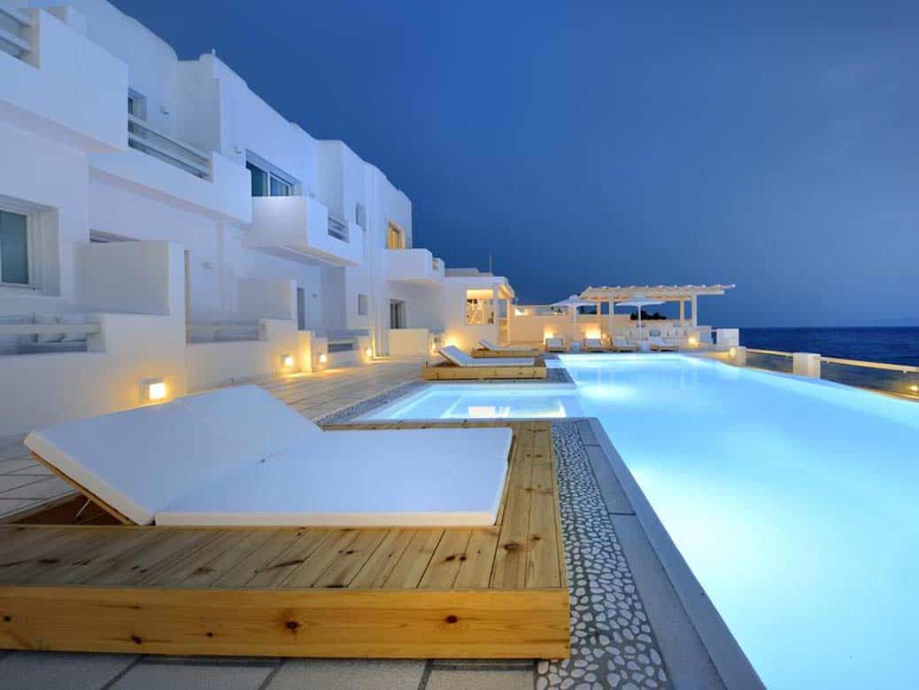 Romantic night hotel photo of swimming pool and building of Nissaki Hotel Mykonos Greece