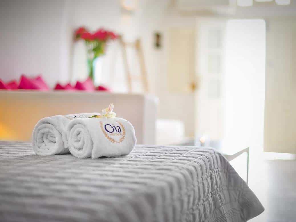 Towels on bed - example of great hotel photos of details of Oia Collection Suites Santorini